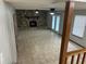 Spacious living room with a stone fireplace, tile flooring, and natural lighting at 1281 Bugle Ct, Hampton, GA 30228