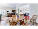 Dining room with wood table, chairs, and view into the kitchen and living space at 1721 Streamview Se Dr, Atlanta, GA 30316