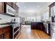 Kitchen featuring stainless steel appliances, wood cabinets, and view into the living space at 1721 Streamview Se Dr, Atlanta, GA 30316