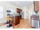 Kitchen featuring stainless steel appliances, wood cabinets, and a breakfast bar at 1721 Streamview Se Dr, Atlanta, GA 30316