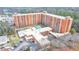 Aerial view of a brick apartment building with an outdoor swimming pool at 300 Johnson Ferry Ne Rd # B411, Atlanta, GA 30328