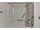 Bright bathroom featuring a clean white tub/shower with safety grab bars and shower head at 300 Johnson Ferry Ne Rd # B411, Atlanta, GA 30328