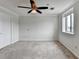 Bedroom with neutral walls and carpet, ceiling fan and window with natural light at 300 Johnson Ferry Ne Rd # B411, Atlanta, GA 30328