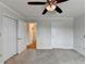 Bedroom with neutral carpet and walls, ceiling fan, and access to the kitchen area at 300 Johnson Ferry Ne Rd # B411, Atlanta, GA 30328