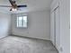 Bedroom with neutral walls, carpet flooring, ceiling fan, window, and closet at 300 Johnson Ferry Ne Rd # B411, Atlanta, GA 30328