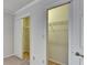 Bedroom closet with bi-fold doors and interior shelving at 300 Johnson Ferry Ne Rd # B411, Atlanta, GA 30328