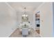 Bright dining room with stylish table set and view to the kitchen, great for everyday meals at 300 Johnson Ferry Ne Rd # B411, Atlanta, GA 30328
