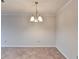 Dining room featuring neutral walls and a view into the kitchen with modern appliances at 300 Johnson Ferry Ne Rd # B411, Atlanta, GA 30328