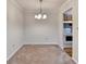 Dining room featuring a chandelier fixture and a view of the kitchen at 300 Johnson Ferry Ne Rd # B411, Atlanta, GA 30328
