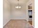 Cozy dining area with a chandelier, seamlessly connected to the kitchen for easy serving at 300 Johnson Ferry Ne Rd # B411, Atlanta, GA 30328