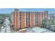Spacious exterior view of a red brick apartment building and adjacent parking at 300 Johnson Ferry Ne Rd # B411, Atlanta, GA 30328