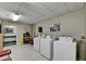 Onsite laundry room with multiple machines and a well-lit space for residents at 300 Johnson Ferry Ne Rd # B411, Atlanta, GA 30328