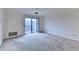 Spacious living room with sliding glass doors leading to a balcony with outdoor views at 300 Johnson Ferry Ne Rd # B411, Atlanta, GA 30328
