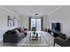 Bright living room featuring neutral tones, modern decor, and a sliding door for seamless indoor-outdoor living at 300 Johnson Ferry Ne Rd # B411, Atlanta, GA 30328