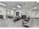 Bright lobby area with tile flooring, seating, and a cozy fireplace at 300 Johnson Ferry Ne Rd # B411, Atlanta, GA 30328