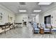 Bright lobby area with tile flooring, seating, and a cozy fireplace at 300 Johnson Ferry Ne Rd # B411, Atlanta, GA 30328