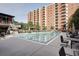 Outdoor swimming pool area with plenty of seating and umbrellas; perfect for enjoying sunny days at 300 Johnson Ferry Ne Rd # B411, Atlanta, GA 30328