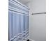 This bathroom shows a blue and white patterned shower curtain at 4701 Flat Shoals Rd # 37C, Union City, GA 30291