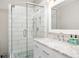 Modern bathroom with glass shower enclosure and marble countertops at 100 Brickworks Ne Cir # 104, Atlanta, GA 30307