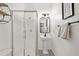 Modern bathroom featuring a glass-enclosed shower and decorative tile flooring at 100 Brickworks Ne Cir # 104, Atlanta, GA 30307