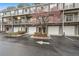 Exterior view of townhome with garage, balcony, and well-maintained landscaping at 100 Brickworks Ne Cir # 104, Atlanta, GA 30307