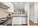 Well-lit kitchen with stainless steel appliances, white subway tile backsplash, and black countertops at 100 Brickworks Ne Cir # 104, Atlanta, GA 30307