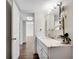 Bright bathroom features a marble vanity top, modern lighting, and fresh white cabinets at 2870 Pharr Court South Nw # 2002, Atlanta, GA 30305