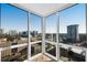 Bright room featuring expansive windows with stunning views of the city skyline at 2870 Pharr Court South Nw # 2002, Atlanta, GA 30305