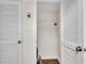 Interior shot of a laundry closet with bifold doors and a wire shelf at 2870 Pharr Court South Nw # 2002, Atlanta, GA 30305