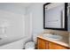 Cozy bathroom features a shower and tub combo, vanity with sink, and framed mirror at 3610 Ginnis Rd # 4, Atlanta, GA 30331