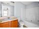 Bathroom features a shower and tub combo, vanity with sink, and framed mirror at 3610 Ginnis Rd # 4, Atlanta, GA 30331