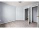 Spacious bedroom featuring neutral carpet, light blue walls, and closet at 3610 Ginnis Rd # 4, Atlanta, GA 30331