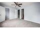 Spacious bedroom featuring neutral carpet, light blue walls, closet, and ceiling fan at 3610 Ginnis Rd # 4, Atlanta, GA 30331