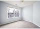 Cozy bedroom with neutral carpet, light blue walls, and natural light from two windows at 3610 Ginnis Rd # 4, Atlanta, GA 30331