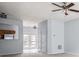 Bright living room with a ceiling fan and a pass through to the kitchen at 3610 Ginnis Rd # 4, Atlanta, GA 30331