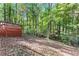 Backyard with a wooded area and deck at 4867 Township Trce, Marietta, GA 30066