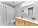 Bathroom featuring a double vanity, mirror, and toilet behind a shower curtain at 4867 Township Trce, Marietta, GA 30066