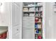 Bathroom closet featuring custom shelving and ample storage for linens and supplies at 4867 Township Trce, Marietta, GA 30066