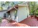 Exterior view of a gray wood home with a spacious red deck at 4867 Township Trce, Marietta, GA 30066