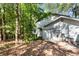 Exterior showing the side of the house with trees at 4867 Township Trce, Marietta, GA 30066