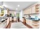 Well-lit kitchen equipped with stainless steel appliances, custom cabinetry, and hardwood flooring at 4867 Township Trce, Marietta, GA 30066