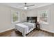 Bright bedroom features hardwood floors, neutral walls, two windows and ceiling fan at 488 Park Valley Nw Dr, Atlanta, GA 30318