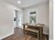 Cozy dining area with a rustic table and a sunlit window with a scenic view at 488 Park Valley Nw Dr, Atlanta, GA 30318