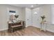 Bright dining area showcasing wood-look flooring, a farmhouse table, and modern trim at 488 Park Valley Nw Dr, Atlanta, GA 30318