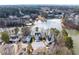 Aerial view of waterfront community with lake, pool, and lush landscaping, showcasing serene residential living at 730 Reeves Lake Sw Dr, Marietta, GA 30064