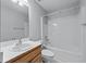 Standard bathroom with a tub and shower combination, a basic vanity, and neutral finishes at 730 Reeves Lake Sw Dr, Marietta, GA 30064
