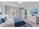 Stylishly furnished bedroom featuring soft blue accents and a window providing natural light at 730 Reeves Lake Sw Dr, Marietta, GA 30064