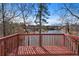 View from the deck of the lake surrounded by trees and community homes in the distance at 730 Reeves Lake Sw Dr, Marietta, GA 30064