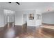 Bright living room featuring hardwood floors, neutral walls, and open access to the kitchen and entryway at 730 Reeves Lake Sw Dr, Marietta, GA 30064