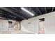 Unfinished basement with open ceiling, stairs to upper level, and white painted walls at 3263 Dodson Dr, Atlanta, GA 30344